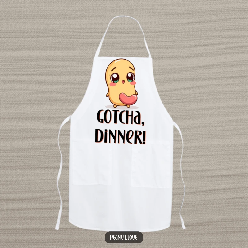 Funny apron showing an excited peanut character with wide eyes reacting to a falling jellybean, a humorous kitchen accessory.