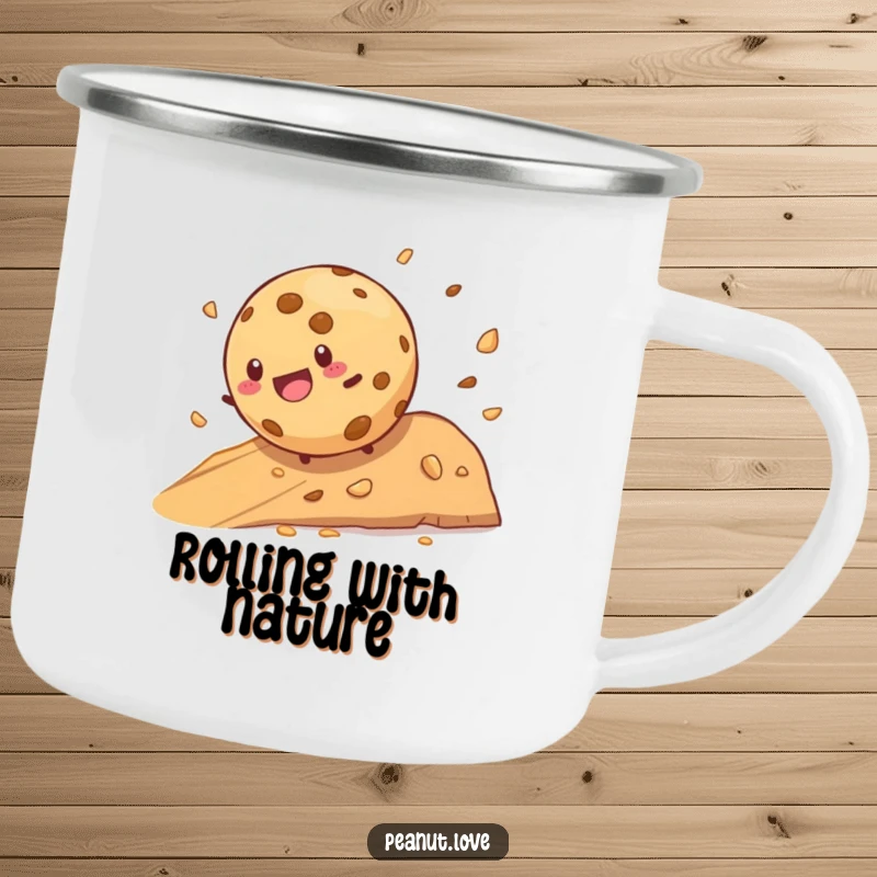 Funny cookie character joyfully rolling down a crumb-filled hill on a humorous camping mug, ideal for outdoors.