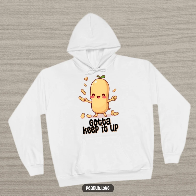 Funny hooded sweatshirt featuring a cute Kawaii peanut happily juggling, offering warmth and humorous charm.