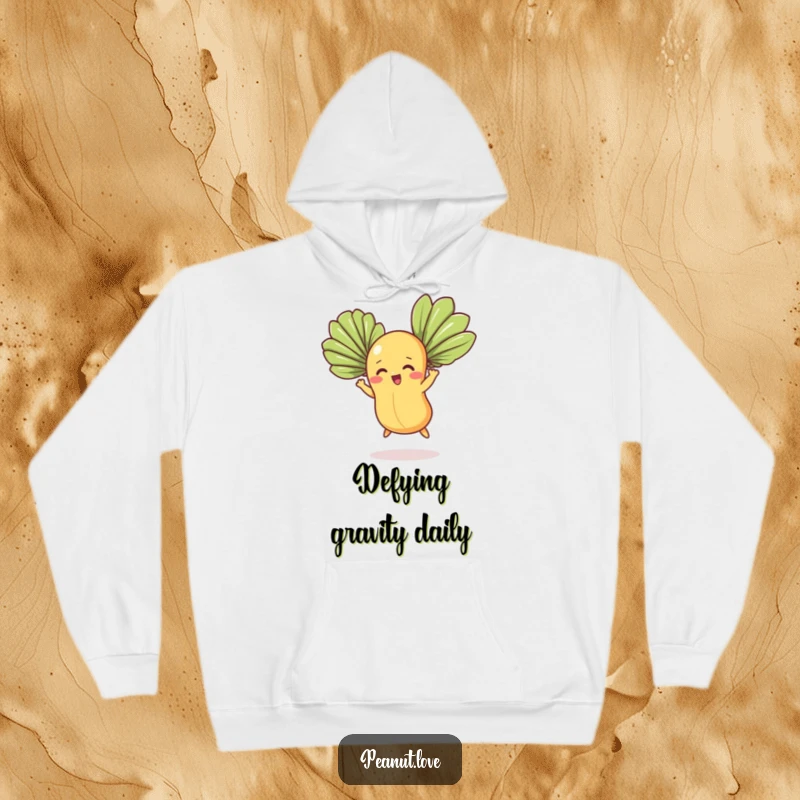 Funny hoodie featuring a nut character with determined expression flying with fan leaves, a comical aviator design for humor lovers.