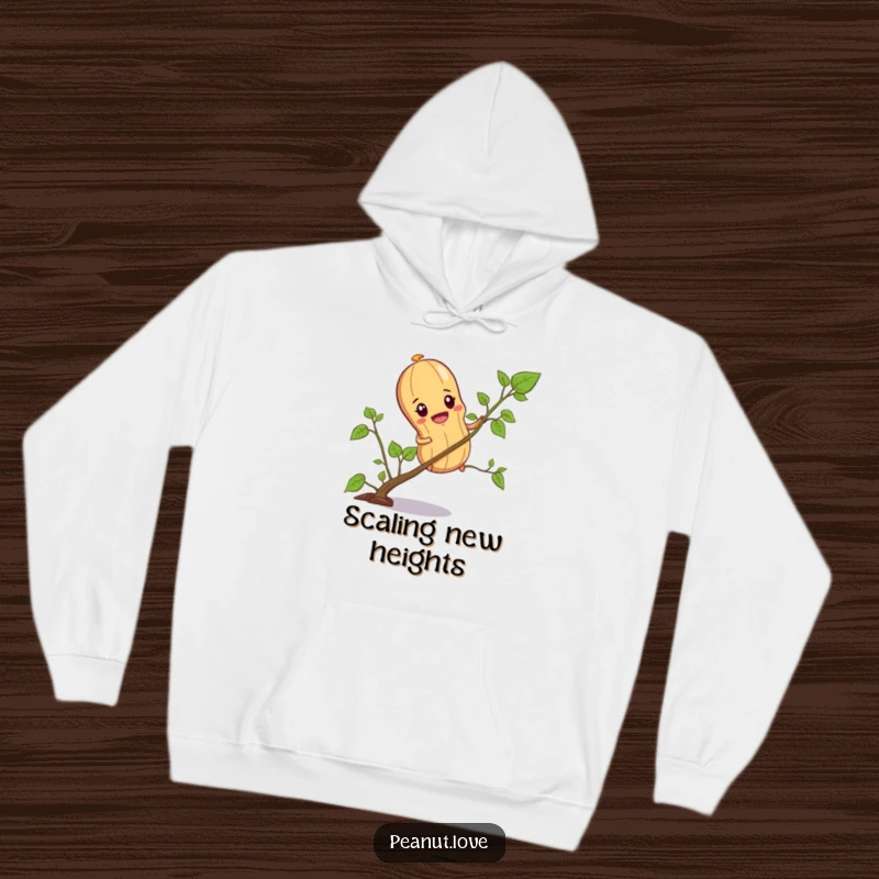 Funny hoodie depicting a determined peanut character climbing a tiny vine, offering cozy comfort and nutty inspiration.