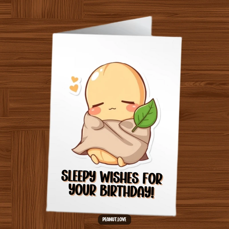 Funny Free Printable Birthday Card: a sleepy peanut character comically bundled under a tiny leaf, looking very comfortable.