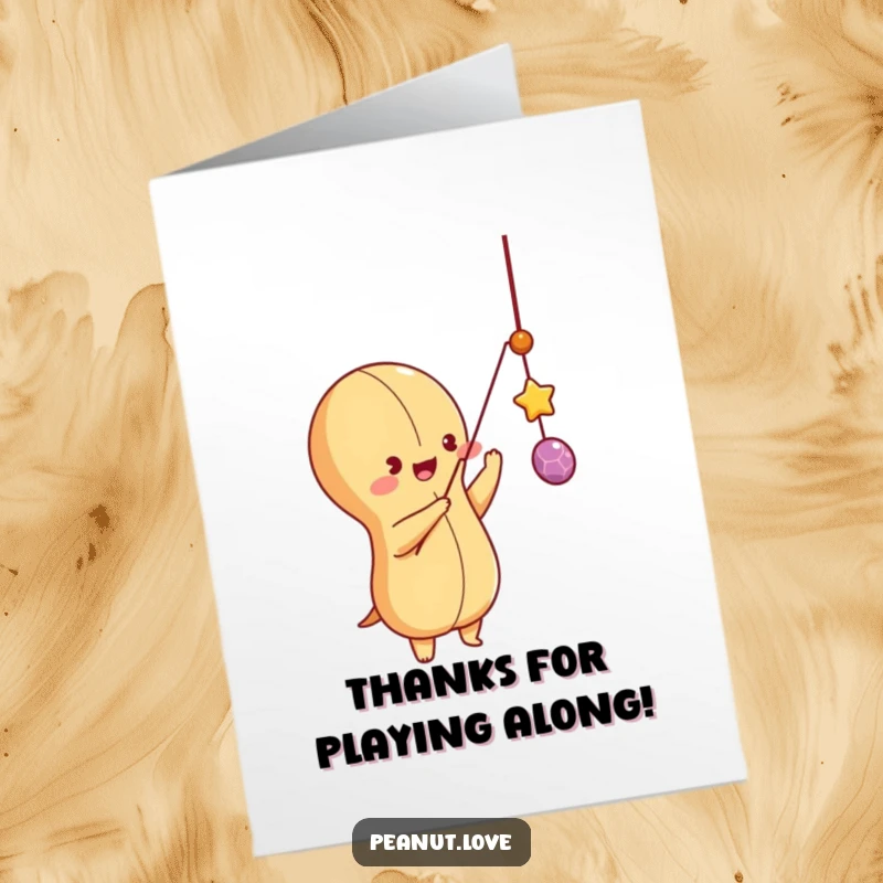 Funny Free Printable playful peanut character batting at a string, showing appreciation with playful charm. Hilarious thanks.