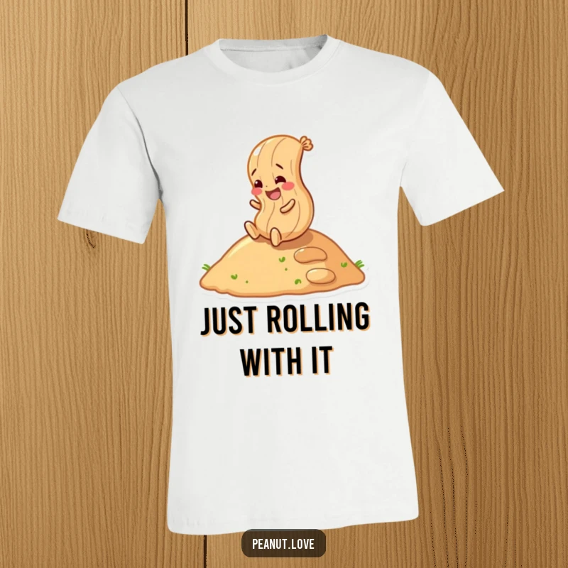 Funny peanut character gleefully rolling down a hill on a t-shirt, symbolizing carefree fun and energy.